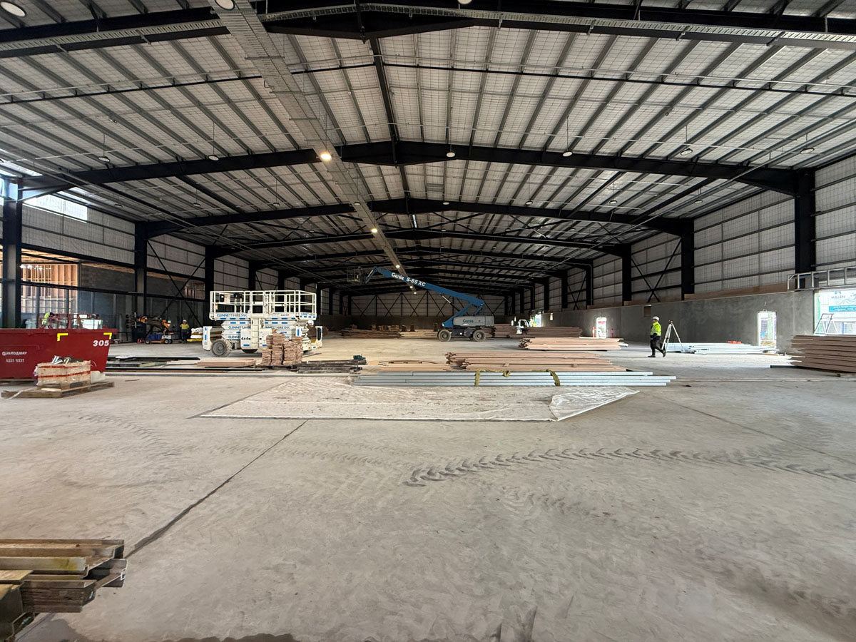 Preparing to lay the wood flooring for indoor courts