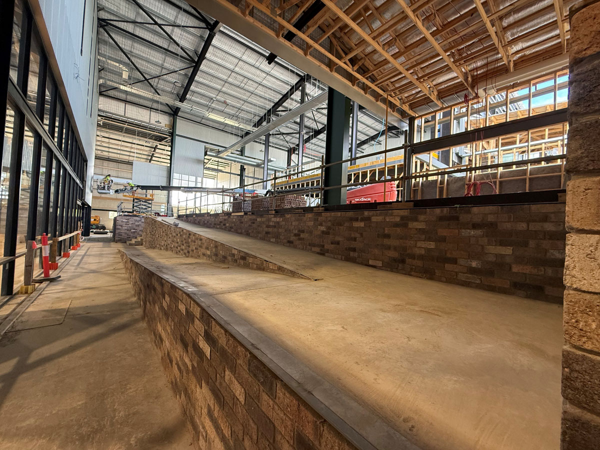 installing ramp access from reception to indoor courts