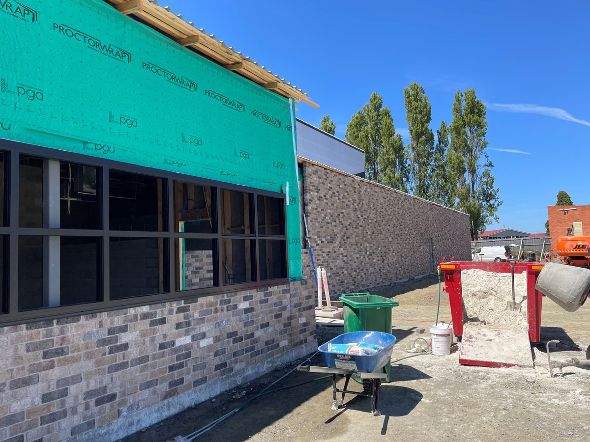 Bricks being laid near main reception area